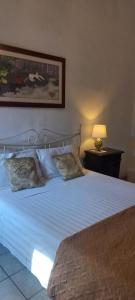 Llit o llits en una habitació de B&B A due passi dal Castello