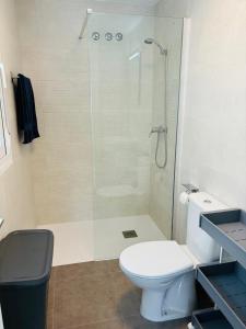 a bathroom with a shower and a white toilet at Alicante City Beach Jacuzzi Luxury Penthouse with Rooftop Terrace in Gran Alacant