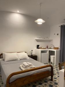 Postel nebo postele na pokoji v ubytování High Point Apartments Fira