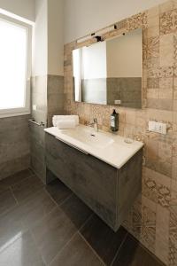 a bathroom with a sink and a mirror at Celeste Affittacamere in Cefalù +32 photos