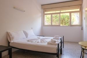 Postel nebo postele na pokoji v ubytování Meet Hostel Cervia