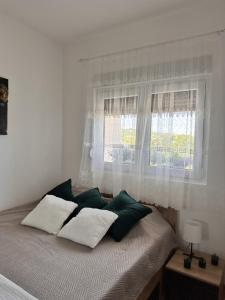 Voodi või voodid majutusasutuse Aria Apartman Sokobanja toas