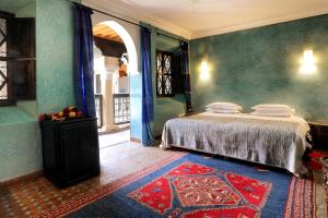 Ein Bett oder Betten in einem Zimmer der Unterkunft Marrakech Riads, Angsana Heritage Collection