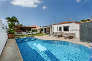 a swimming pool in the backyard of a house at Casa Zara in San Miguel de Abona