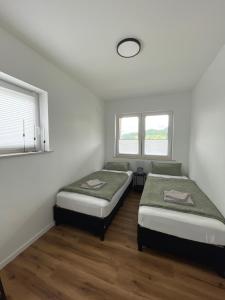 Postel nebo postele na pokoji v ubytování Ferienwohnung am Felsenmeer