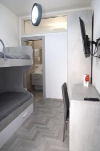 Postel nebo postele na pokoji v ubytování Alloggio Pulcinella 2 Affittacamere + 5 fotografií