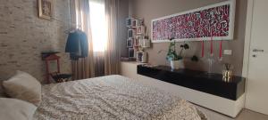 A bed or beds in a room at Квартира люкс в Милане (Appartamento di lusso a Milano)