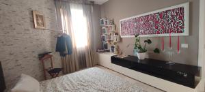 A bed or beds in a room at Квартира люкс в Милане (Appartamento di lusso a Milano)
