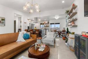 a living room with a couch and a table at Soul Shine - Gorgeous Views - Modern - NEW in Joshua Tree