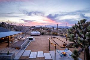 a park with benches and a sunset in the background at Soul Shine - Gorgeous Views - Modern - NEW in Joshua Tree