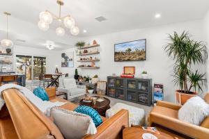 a living room with couches and a table at Soul Shine - Gorgeous Views - Modern - NEW in Joshua Tree