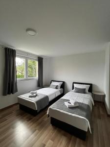 Postel nebo postele na pokoji v ubytování Apartman Iva