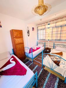 Postel nebo postele na pokoji v ubytování Sunrise Hostel Taghazout