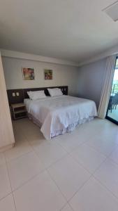 Katil atau katil-katil dalam bilik di Flat Paraíso na Terra Tabatinga Residence +18 gambar