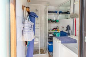 a small bathroom with a sink and a closet at Villa Letizia Santa Luria Sea View - IUN R9232 in Quartu SantʼElena +58 photos
