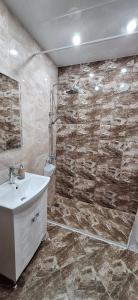 a bathroom with a sink and a shower at Home VIZA - 2 in Yambol