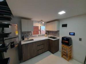 Dúplex con hermosa vista a la ciudad deck exterior廚房或簡易廚房