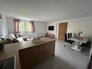a living room with a couch and a table at Apartman Iva in Posušje