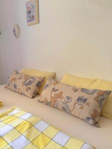 two pillows sitting on a bed in a room at Horizon Apartament Gut in Sveti Vlas +26 photos