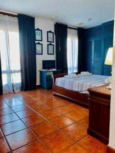 Ένα ή περισσότερα κρεβάτια σε δωμάτιο στο Villa Allyson B&B