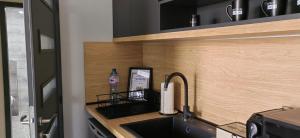 Kuchyň nebo kuchyňský kout v ubytování Apartmenthaus Oborishte - 17