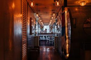 a hallway of a restaurant with a table at The Click Clack Hotel Bogotá in Bogotá