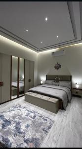 a bedroom with a large bed and a large rug at شقه فاخره بجوار الراشد مول in Sīdī Ḩamzah