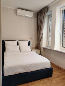 Postel nebo postele na pokoji v ubytování Kyiv Honchara Hotel