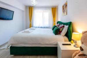 Postel nebo postele na pokoji v ubytování Sia's Apartment