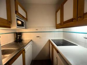 Kuchyň nebo kuchyňský kout v ubytování Résidence Carroley B - Appartement tout confort · Proche des pistes · Vue pistes MAE-3589