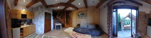 a large room with a kitchen and a living room at Domek Gabi in Ząb