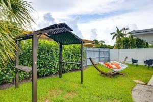 a gazebo and a hammock in a yard at Pet-Friendly Gem with Pool and Yard in West Palm Beach in West Palm Beach