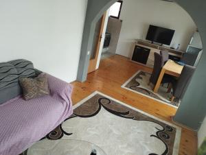 a living room with a couch and a table at Riki Apartments in Sarajevo