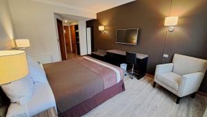 Postel nebo postele na pokoji v ubytování Hotel Diego de Almagro Osorno