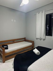 Ένα ή περισσότερα κρεβάτια σε δωμάτιο στο Apartamento Duplo