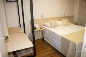 Postel nebo postele na pokoji v ubytování Golden Ingá Hotel