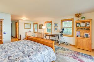 a bedroom with a bed and a desk at Oceanfront Frenchman Bay Home Stunning View! in Marlboro
