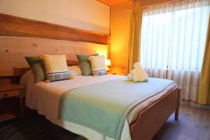 Cama ou camas em um quarto em Hotel El Coihue