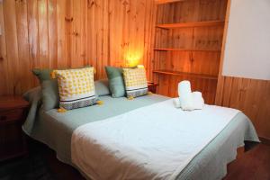 Cama ou camas em um quarto em Hotel El Coihue