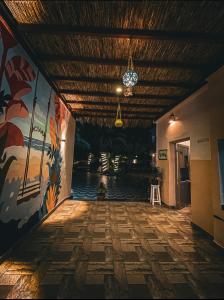 an empty hallway with a painting on the wall and a ceiling at Miramar Camp Dahab in Dahab
