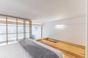 Posteľ alebo postele v izbe v ubytovaní Galileo apartment