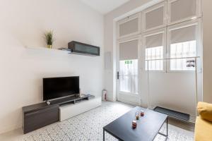 Televízia a/alebo spoločenská miestnosť v ubytovaní Galileo apartment