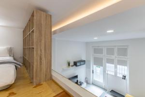 Posteľ alebo postele v izbe v ubytovaní Galileo apartment