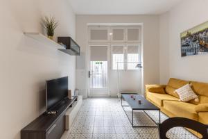Televízia a/alebo spoločenská miestnosť v ubytovaní Galileo apartment