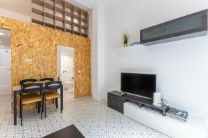 Televízia a/alebo spoločenská miestnosť v ubytovaní Galileo apartment