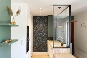 a bathroom with a sink and a mirror at La parenthèse in Cabourg