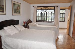 Un pat sau paturi într-o cameră la Pinares del Carrizalito