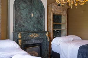 Ένα ή περισσότερα κρεβάτια σε δωμάτιο στο Charming Renovated Capitol Hill House - SLC