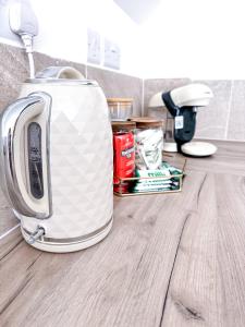 a toaster sitting on top of a kitchen counter at Luxe Haven - Sleeps 4 Apartment Nottingham City Centre in Nottingham