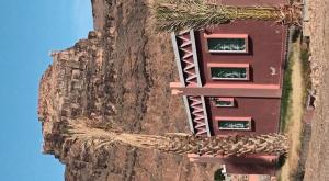 a building on the side of a mountain at Hotel camping amtoudi in Id AÃ¯ssa +17 photos
